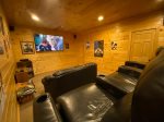 Lower level theater room with a 75 smart TV 
